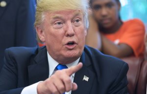 US President Donald Trump speaks before signing a memorandum on increasing access to science, technology, engineering and mathematics education in the Oval Office of the White House on September 25, 2017 in Washington, DC. (Credit: MANDEL NGAN/AFP/Getty Images)