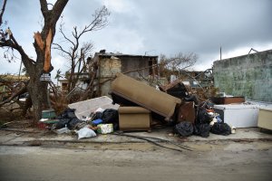 View of furniture near damaged houses in Punta Cabeza, Humacao, in the east of Puerto Rico, on September 27, 2017, one week after the passage of Hurricane Maria. (Credit: HECTOR RETAMAL/AFP/Getty Images)