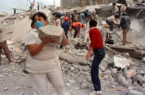 Rescue workers and volunteers sift through the rubble of a collapsed building in "Zona Rosa" area of Mexico City, a popular commercial and tourist area, Sept. 21, 1985, after an earthquake leveled parts of the city Sept. 19, 1985. (Credit: Omar Torres / AFP / Getty Images)