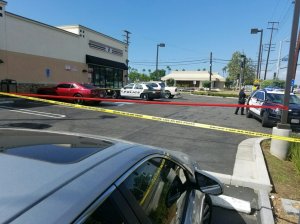 Police investigate an officer's shooting of a man at a Huntington Beach 7-Eleven on Sept. 22, 2017.