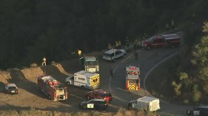Emergency vehicles respond a car over the side of Glendora Mountain Road on Sept. 28, 2017. (Credit: KTLA)