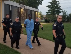 Emanuel Kidega Samson is seen being transported to a Tennessee jail in a photo released by the Metro Nashville Police Department on Sept. 24, 2017.