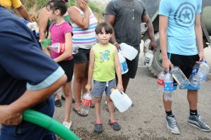 On Tuesday, September 26, 2017, members of the Puerto Rico National and the Aqueducts and Sewers Authority distributed water to residents of Utuado. (Credit: Puerto Rico National Guard)