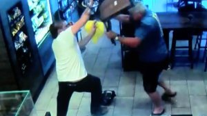 A still from surveillance video shows a man thwarting a would be robber during an incident at a Fresno Starbucks in July, 2017.