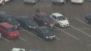 A vehicle parked on the Santa Monica Pier on Sept. 11, 2017 is inspected by a SWAT officer. (Credit: KTLA)