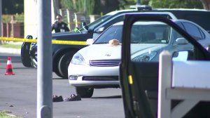 A hat and shoes belonging to a man who was injured in a West Hills crash remained at the scene on Sept. 7, 2017. (Credit: KTLA)