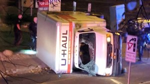 A rental truck lies on its side in Edmonton, Canada, on October 1, 2017, after a high speed chase.