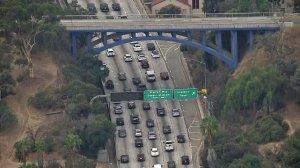 The Park Road bridge over the 110 Freeway near Dodger Stadium, shown Oct. 31, 2017, was painted blue in advance of Game 6 of the World Series. (Credit: KTLA)