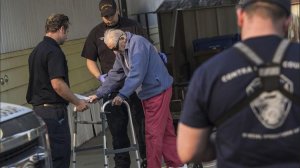 Contra Costa County paramedics help Bill Parras, 96, leave his home in Calistoga, Calif., during this week's wildfires. (Credit: Marcus Yam / Los Angeles Times)