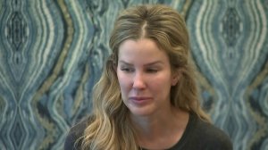 Karissa Fenwick gives a tearful account of the sexual advances she says Erick Guerrero, an associate professor at USC, made toward her. (Credit: KTLA)