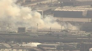 A structure fire is seen ay at a recycling facility in downtown Los Angeles. (Credit: KTLA)