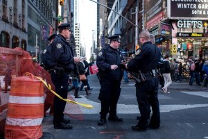 Police officers keep watch in Times Square following a series of terrorist attacks in Paris on Nov. 14, 2015, in New York City. (Credit: Andrew Renneisen / Getty Images)