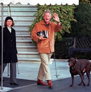 President Bill Clinton, his daughter Chelsea and family dog "Buddy" leaves the White House for a weekend retreat at Camp David on Nov. 20, 2000.(Credit: Manny Ceneta/AFP/Getty Images)