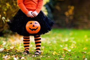 A child is seen having fun at a Halloween trick or treat. (Credit: iStock / Getty Images Plus)