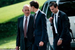 White House Chief of Staff John Kelly and Senior Advisor Jared Kushner follow President Donald Trump to Marine One at the White House on Aug. 3, 2017, the same day reports surfaced of a grand jury in the Russia investigation. (Credit: Brendan Smialowski/AFP/Getty Images)