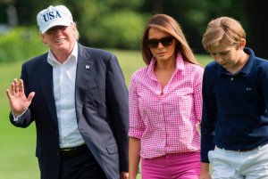 President Donald Trump, First Lady Melanie Trump and son Barron, walk from Marine One upon arrival on the South Lawn of the White House on Aug. 27, 2017, after spending the weekend at Camp David. (Credit: Saul Loeb/AFP/Getty Images)