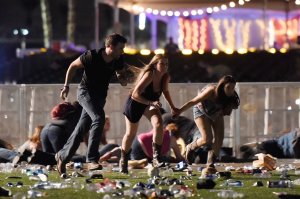 People run from the Route 91 Harvest country music festival after apparent gun fire was hear on October 1, 2017 in Las Vegas, Nevada. (Credit: David Becker/Getty Images)