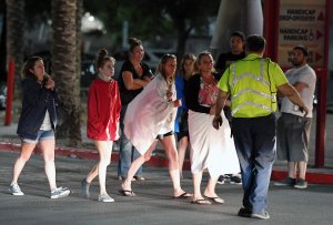 People are directed to rides outside the Thomas & Mack Center after a mass shooting at a country music festival on October 2, 2017 in Las Vegas. (Credit: Ethan Miller/Getty Images)