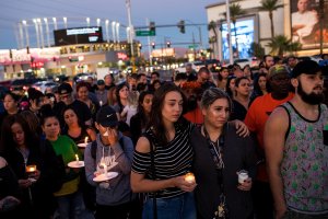 Mourners attend a candlelight vigil at the corner of Sahara Avenue and Las Vegas Boulevard for the victims of Sunday night's mass shooting, October 2, 2017 in Las Vegas, Nevada. (Credit: Drew Angerer/Getty Images)
