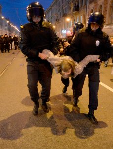 Russian police officers detain a protester during an unauthorized rally in Saint Petersburg on Oct. 7, 2017. (Credit: Olga Maltseva / AFP / Getty Images)