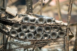 Melted wine bottles are seen among the burned out remains of the Signorello Estate Winery in Napa on Oct. 11, 2017. (Credit: Josh Edelson / AFP / Getty Images)
