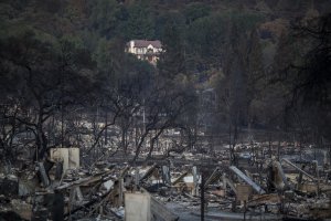 The ruins of houses destroyed by the Tubbs Fire are seen near Fountaingrove Parkway on October 14, 2017 in Santa Rosa. (Credit: David McNew/Getty Images)