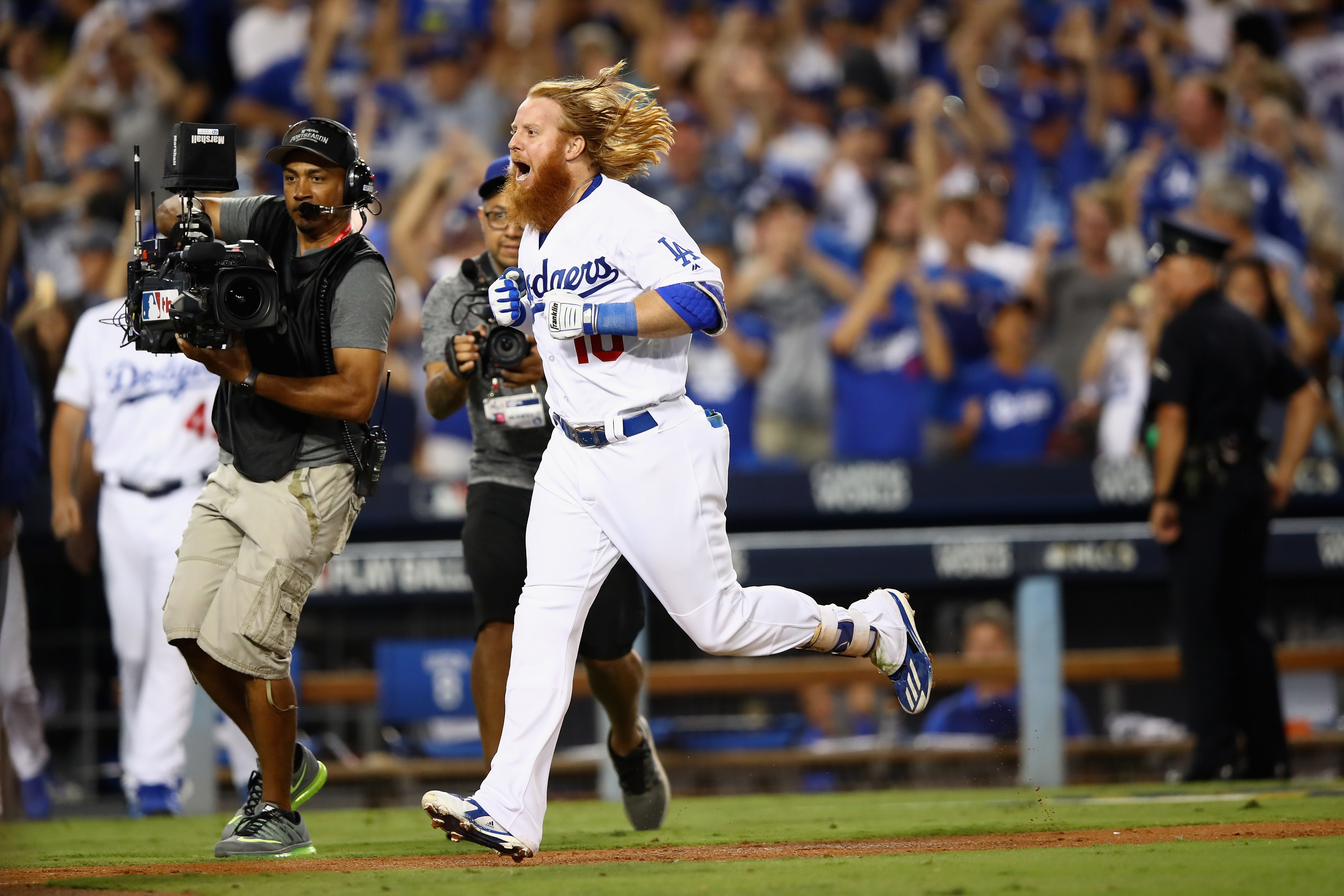Justin Turner jobs home after hitting the winning home run in the bottom of the ninth during game two of the National League Championship Series against the Chicago Cubs at Dodger Stadium on October 15, 2017. (Credit: Ezra Shaw/Getty Images)