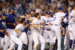 The Dodgers celebrate after Justin Turner hit the winning home run in the bottom of the ninth game two of the National League Championship Series against the Chicago Cubs at Dodger Stadium on October 15, 2017. (Credit: Ezra Shaw/Getty Images)