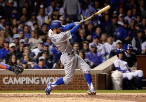 Chris Taylor of the Los Angeles Dodgers hits a triple in the fifth inning against the Chicago Cubs during game three of the National League Championship Series at Wrigley Field on October 17, 2017 in Chicago. (Credit: Jamie Squire/Getty Images)