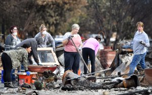 Residents search for an engagement ring at a burned residence in Santa Rosa, California on October 20, 2017. Residents are being allowed to return to their burned homes on October 20 to grieve and search through remains. (Credit: Josh Edelson/AFP/Getty Images)