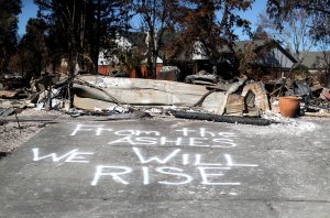 A message is written on driveway of a Coffey Park home that was destroyed by the Tubbs Fire on Oct. 23, 2017, in Santa Rosa. (Credit: Justin Sullivan / Getty Images)