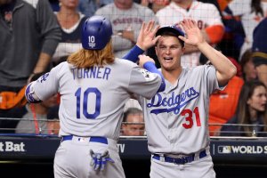 Dodgers player Justin Turner celebrates scoring an RBI single during the first inning with teammate Joc Pederson in Game 5 of the 2017 World Series against the Houston Astros at Minute Maid Park on Oct. 29, 2017, in Houston, Texas. (Credit: Christian Petersen/Getty Images)