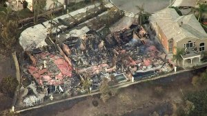 Three homes destroyed by Canyon Fire 2 are seen in Anaheim Hills on Oct. 10, 2017. (Credit: KTLA)