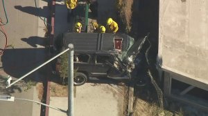 A crash in Lake View Terrace that happened right after a shooting left a man dead on Oct. 16, 2017. (Credit: KTLA)