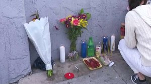 A small memorial is seen outside the store where Danny Bunthung was fatally shot. (Credit: KTLA)