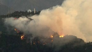 A brush fire burning on Mt. Wilson is seen on Oct. 17, 2017. (Credit: KTLA)