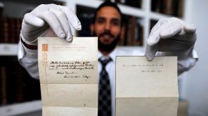 Two handwritten notes penned by Albert Einstein have been sold at auction for a combined $1.8 million. (Credit: Menahem Kahana/AFP/Getty Images)