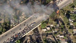 Traffic was backed up on the 118 Freeway in Granada Hills as firefighters tried to put out a blaze on Oct. 24, 2017. (Credit: KTLA)