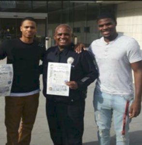 LAPD Officer Kenneth Baxter and his sons are seen in a photo from a fundraising page.