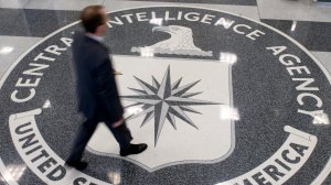 A man crosses the Central Intelligence Agency (CIA) seal in the lobby of CIA Headquarters in Langley, Virginia, on Aug. 14, 2008. 9çredit: Saul Loeb/AFP/Getty Images)