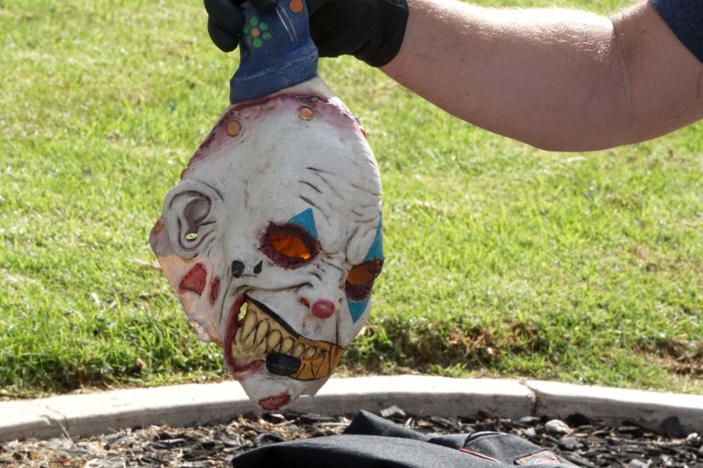 Police display a clown mask found on one of the two suspects in custody for an armed robbery in Newberry Park on Nov. 17, 2017. (Credit: Joel Council / Safety for Citizen)