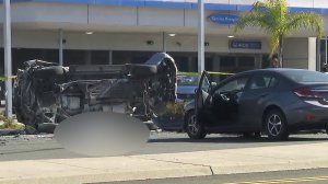 One person died after an SUV rolled over and ejected a passenger in Torrance on Nov. 14, 2017. (Credit: KTLA)