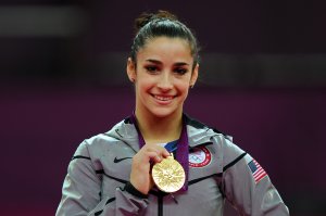 Gold medalist Alexandra Raisman poses on the podium on Day 11 of the London 2012 Olympic Games. (Credit: Michael Regan/Getty Images)