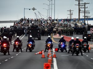 Anti-Trump protesters are moved away from the Convention Center after a rally outside Republican presidential candidate Donald Trump's event in San Diego on May 27, 2016. (Credit: Mark Ralston / AFP / Getty Images)