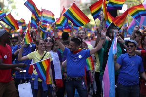 Parade participants wave pride flags during the 2016 San Francisco Pride Parade on June 26, 2016. (Credit: Justin Sullivan / Getty Images)