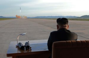 This undated picture released from North Korea's official Korean Central News Agency (KCNA) on Sept. 16, 2017, shows North Korean leader Kim Jong-Un inspecting a launching drill of the medium-and-long range strategic ballistic rocket Hwasong-12 at an undisclosed location. (Credit: STR / AFP / Getty Images)