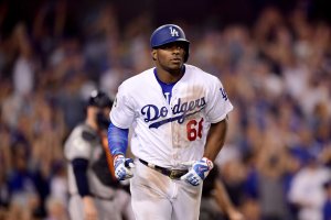 Yasiel Puig of the Los Angeles Dodgers reacts after hitting a solo home run during the tenth inning against the Houston Astros in game two of the 2017 World Series at Dodger Stadium on October 25, 2017. (Credit: Harry How/Getty Images)