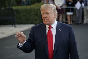 US President Donald Trump talks to reporters November 3, 2017 at the White House in Washington before departing for a 12-day trip to Asia. (Credit: MANDEL NGAN/AFP/Getty Images)