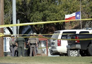 Law enforcement officials gather near the First Baptist Church following a shooting on Nov. 5, 2017, in Sutherland Springs, Texas. (Credit: Erich Schlegel / Getty Images)