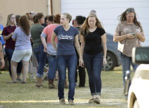 People gather near First Baptist Church following a shooting on Nov. 5, 2017, in Sutherland Springs, Texas. (Credit: Erich Schlegel / Getty Images)